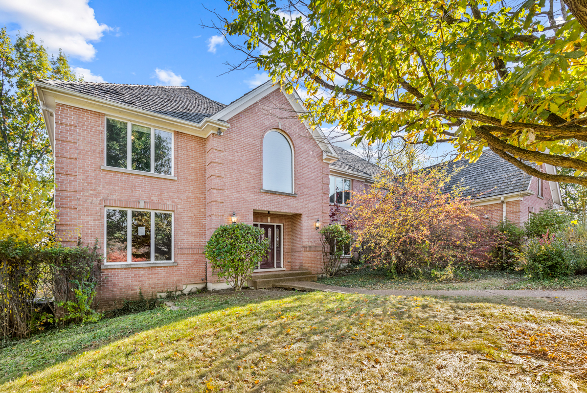 front view of a house with a yard