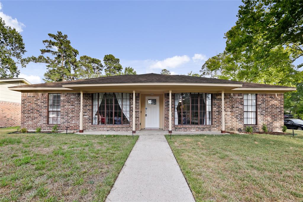 front view of a house that has a yard