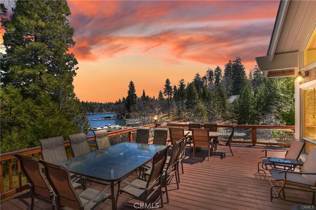 a view of a dinning table and chairs on the roof deck