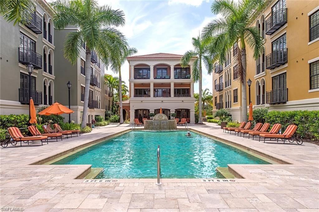 a view of a house with swimming pool and sitting area