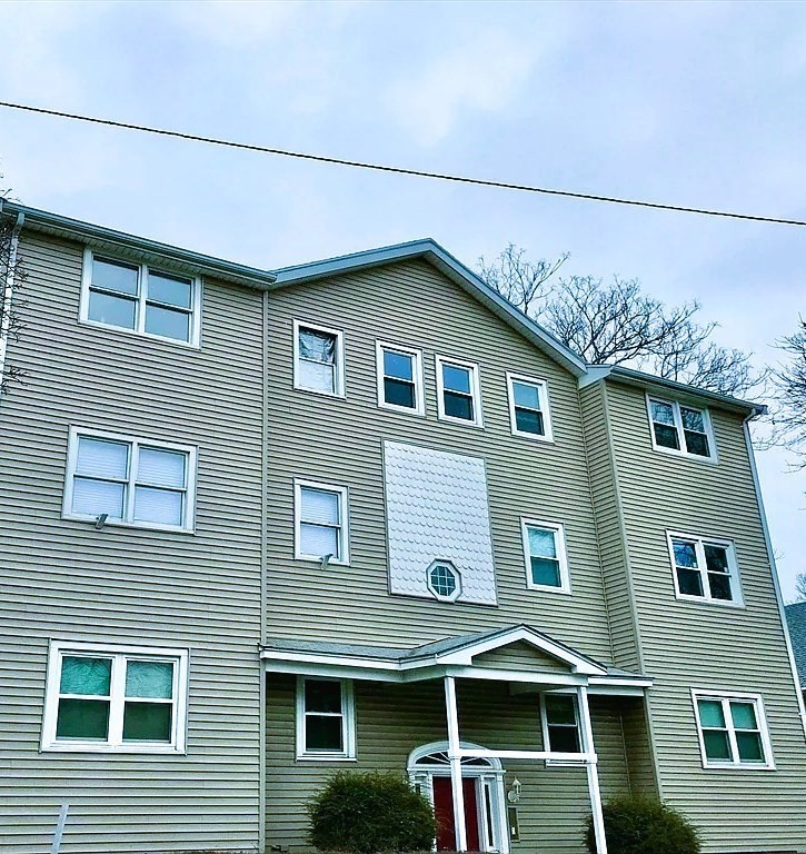 a front view of a house with a balcony