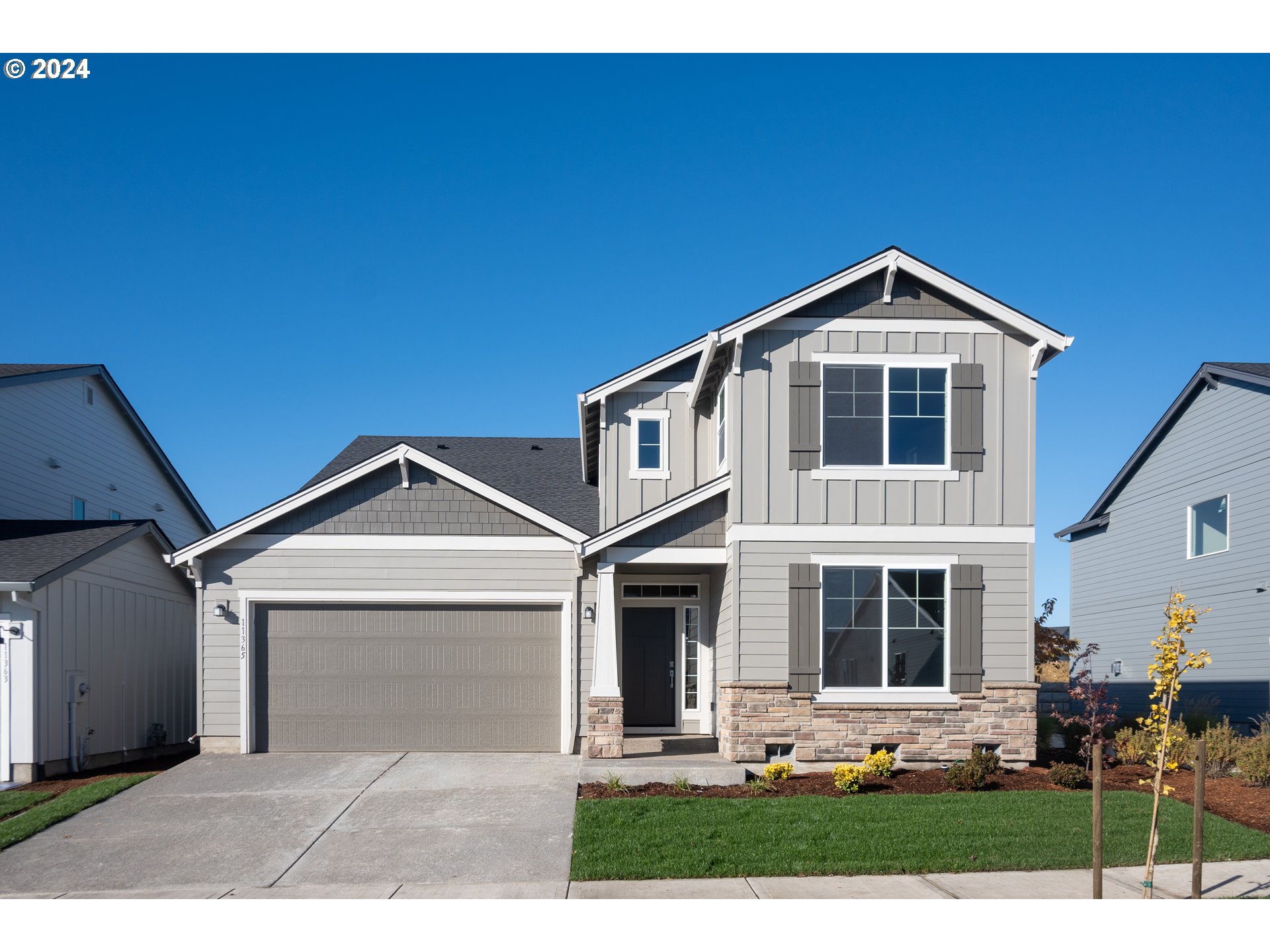 a front view of a house with yard