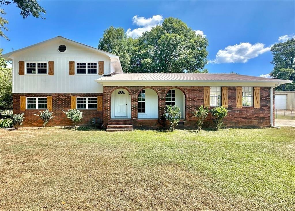 a front view of a house with a yard