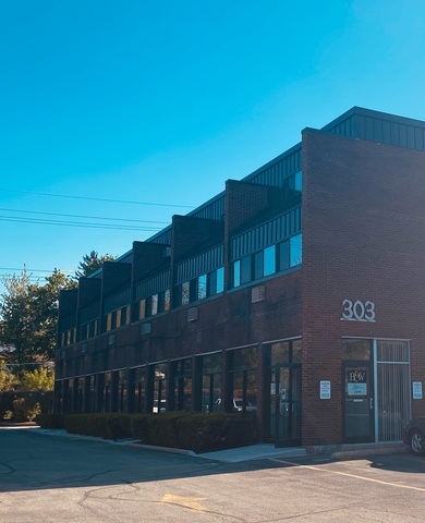 a front view of building with yard