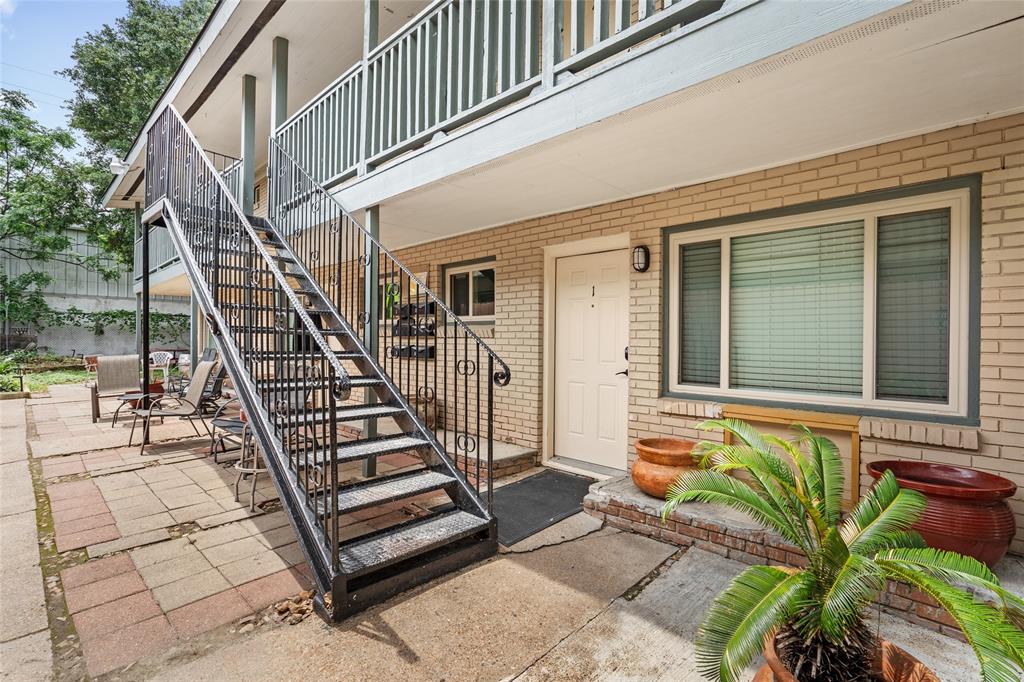 a view of front door of house with stairs