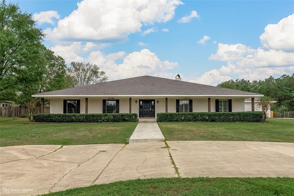 a front view of a house with yard