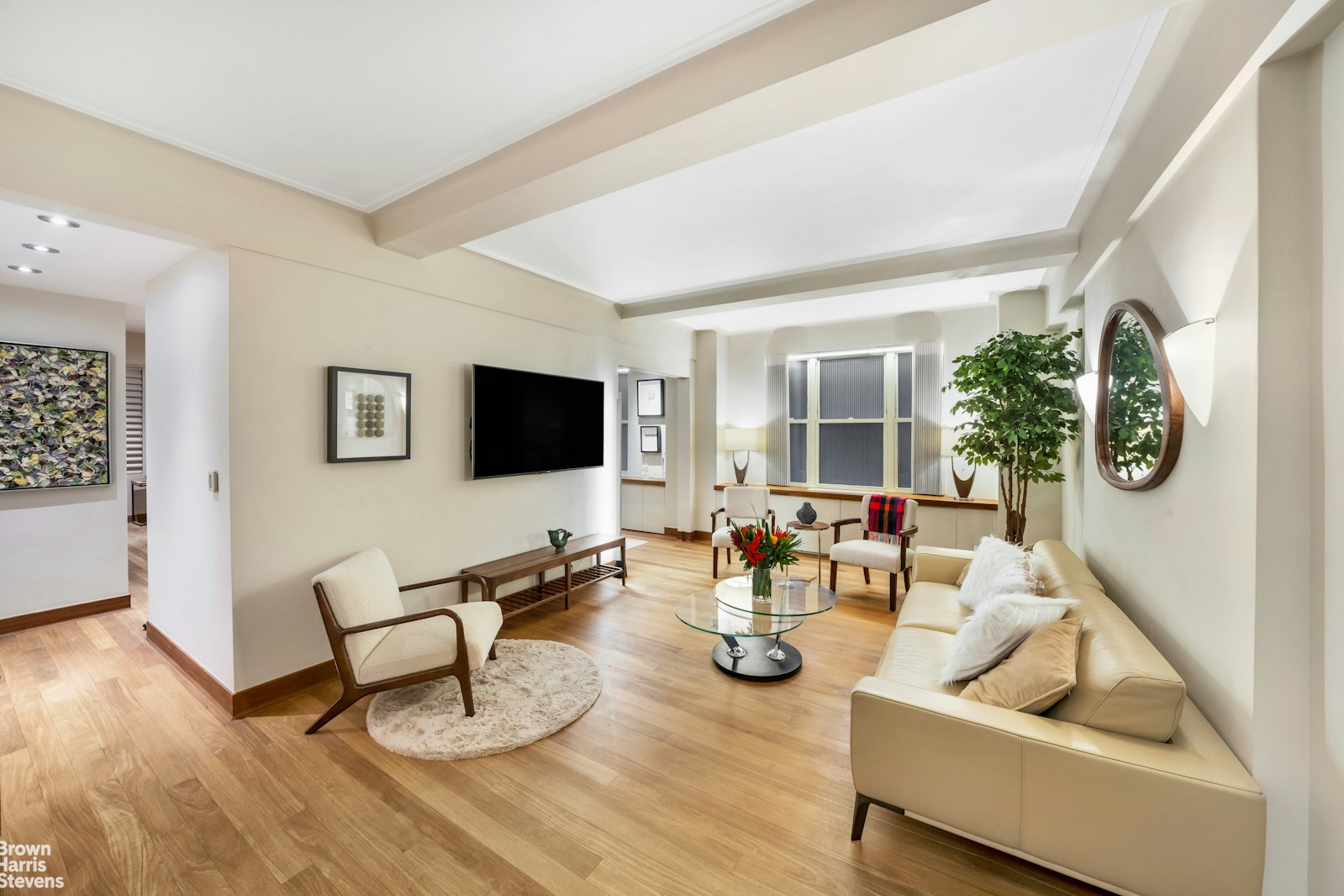 a living room with furniture and a flat screen tv