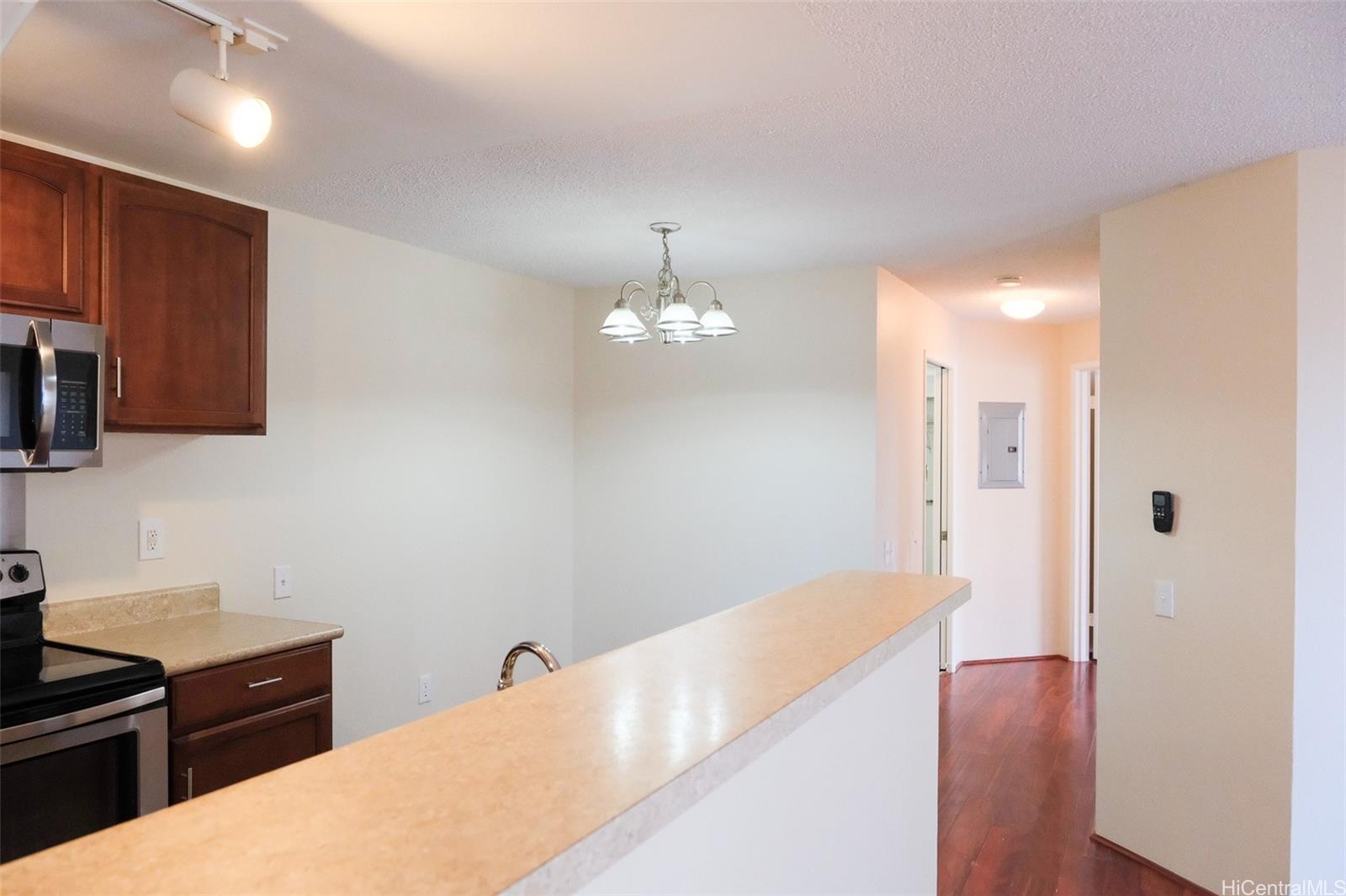 a kitchen with a refrigerator and a sink