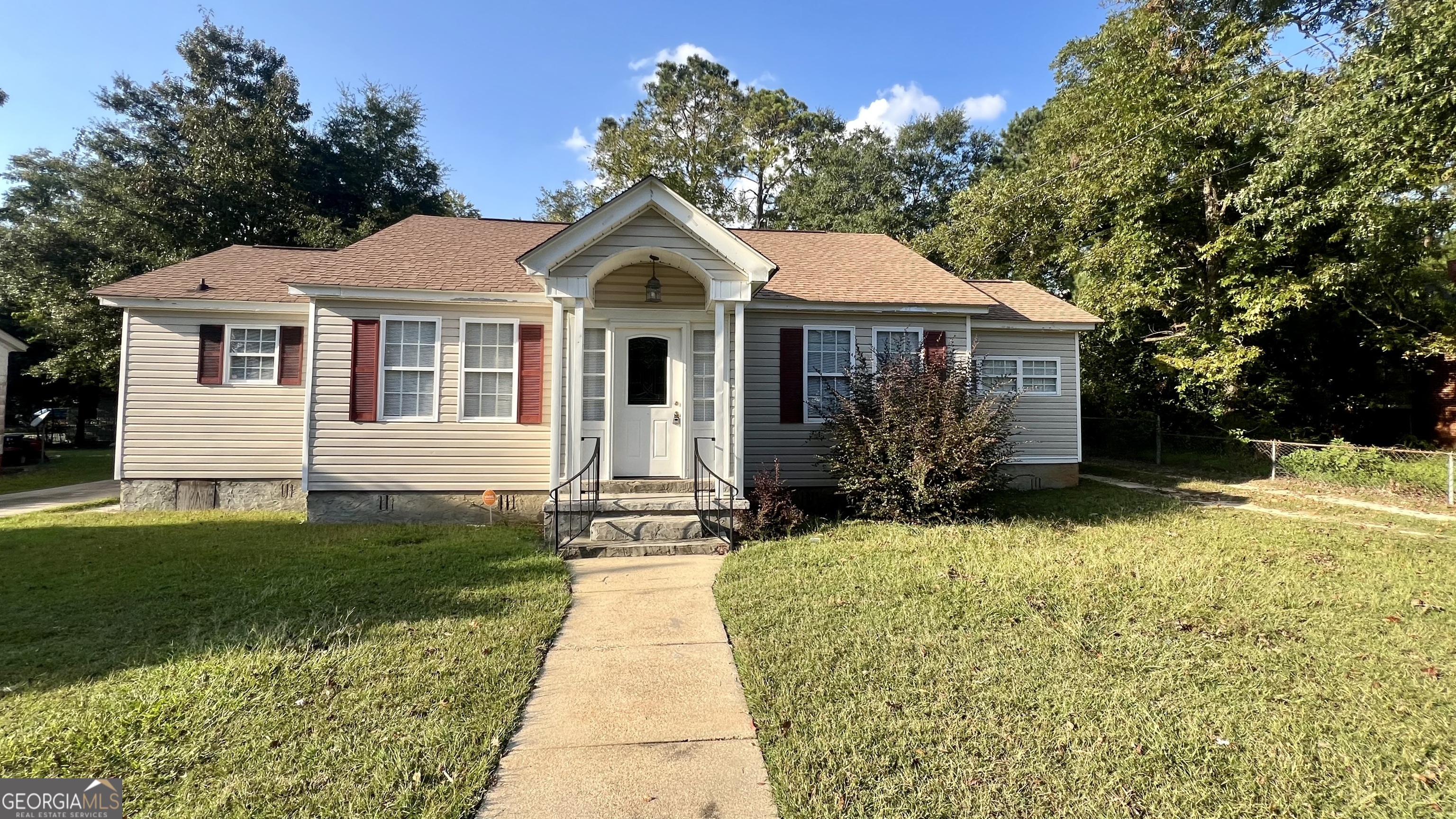 a front view of a house with yard