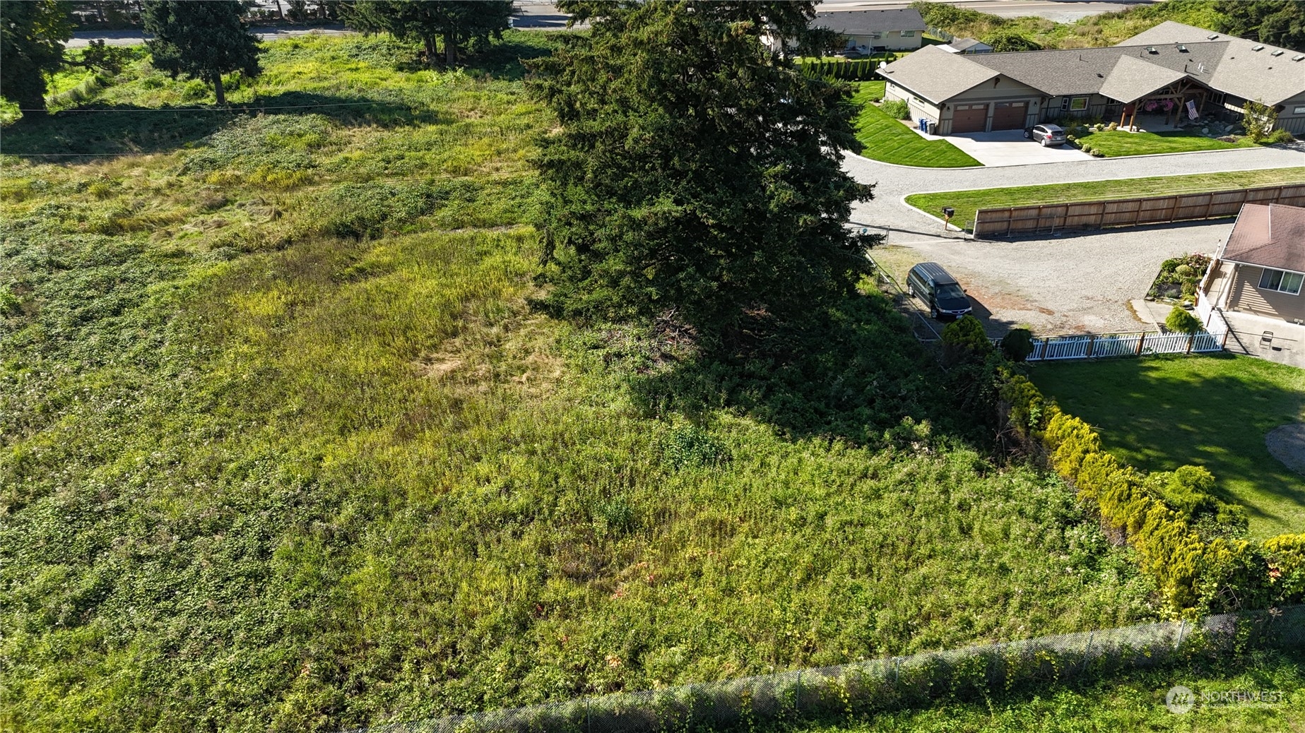 a bird view of a house with a yard