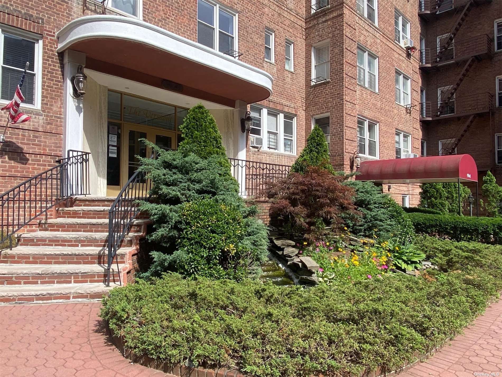 a house view with a garden space