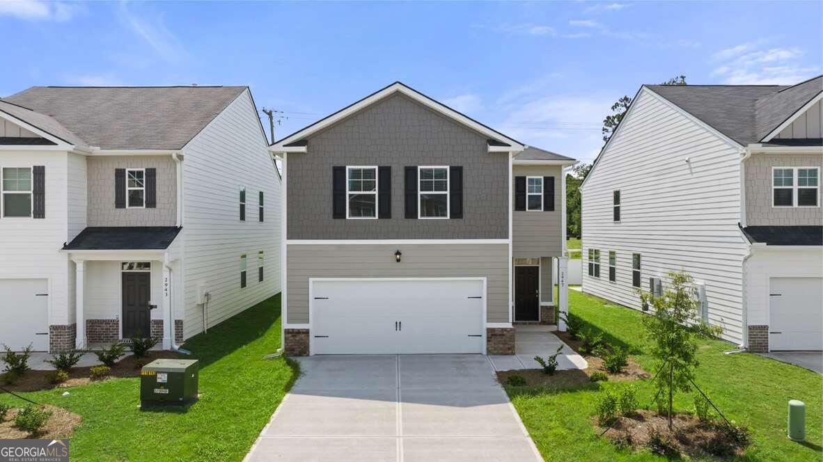 a front view of a house with a yard