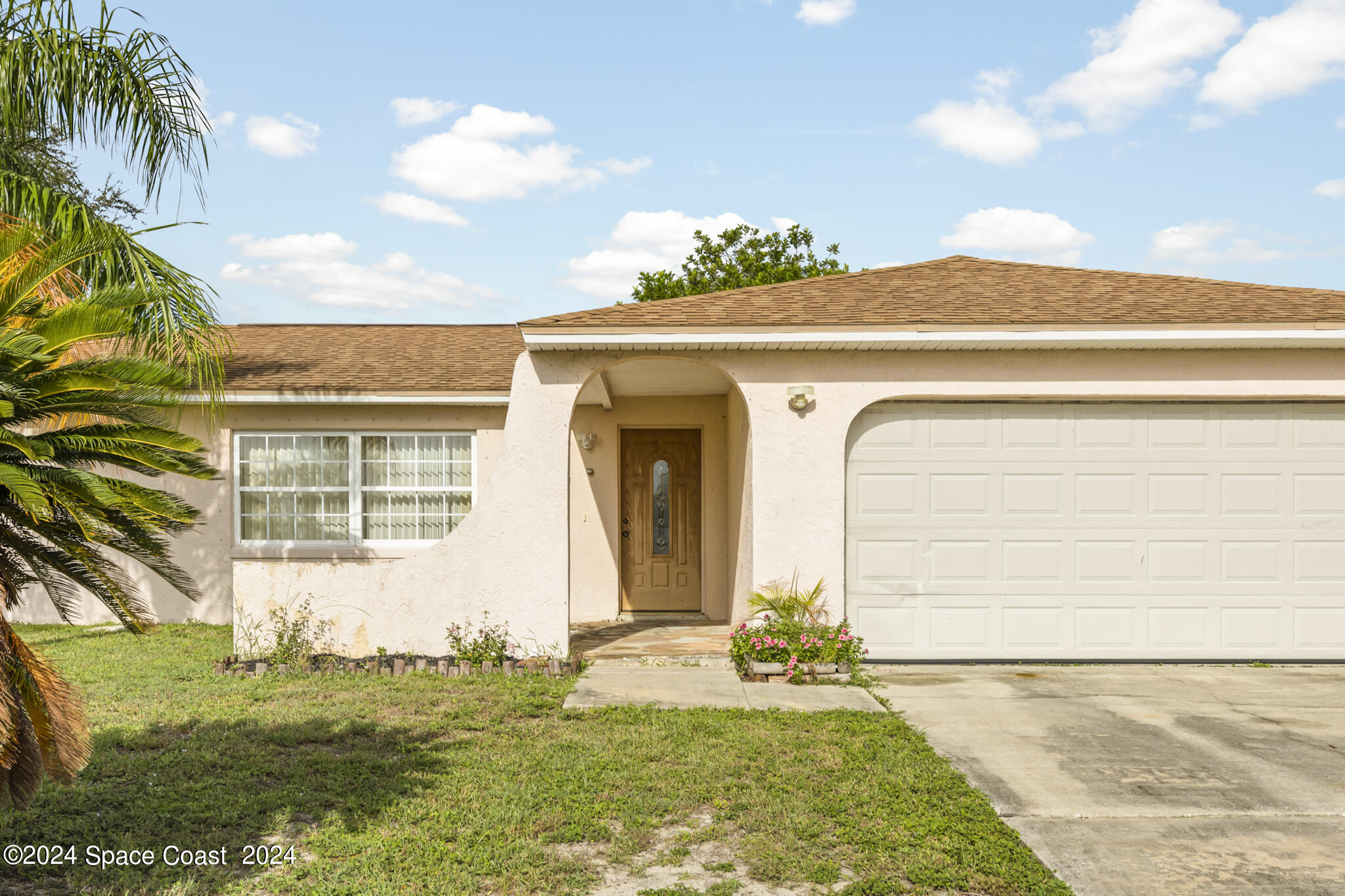 a front view of a house with a yard