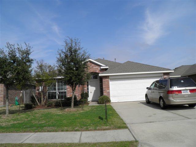 a view of a car parked in front of a house