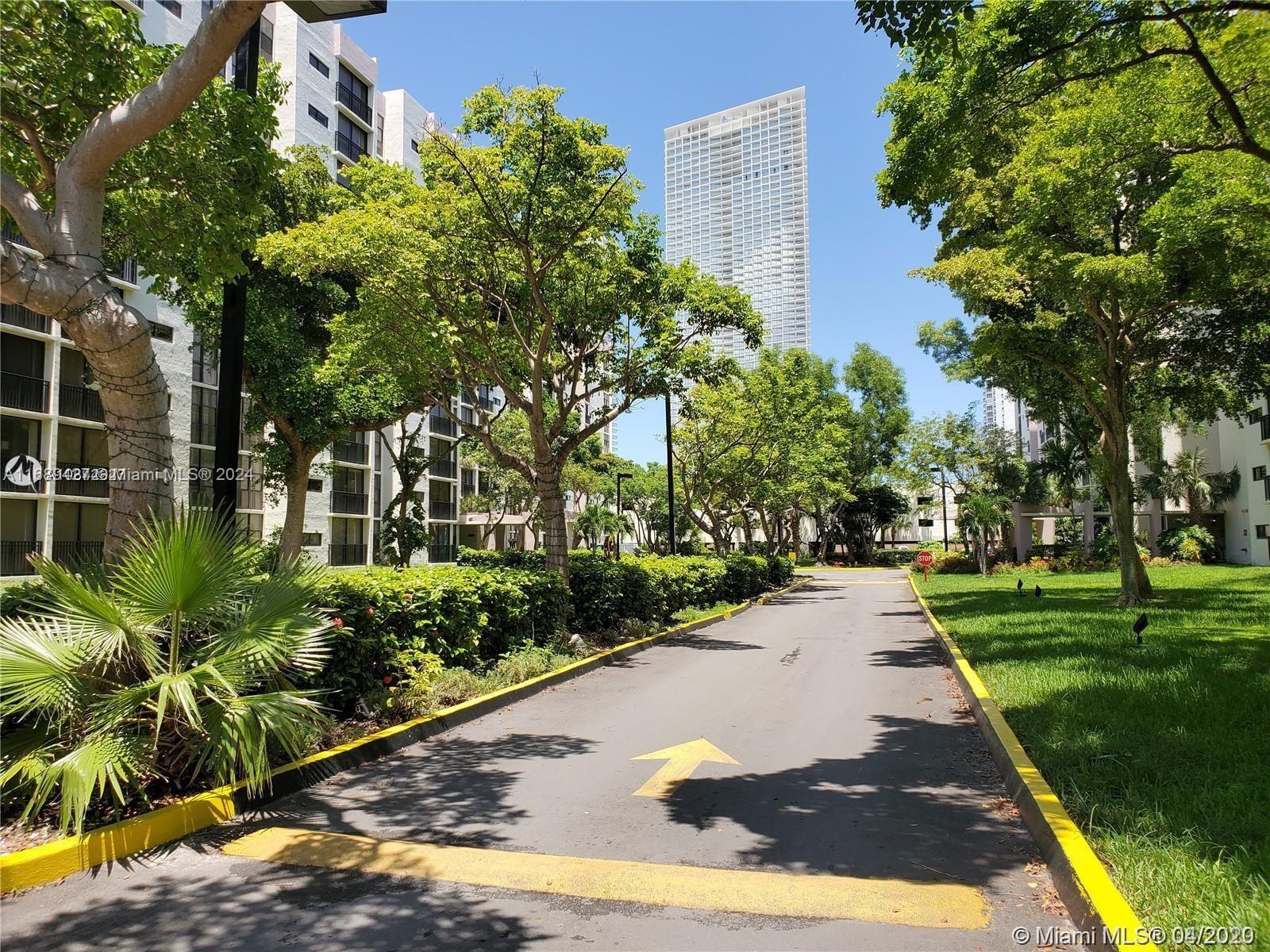 a view of a park with plants and trees