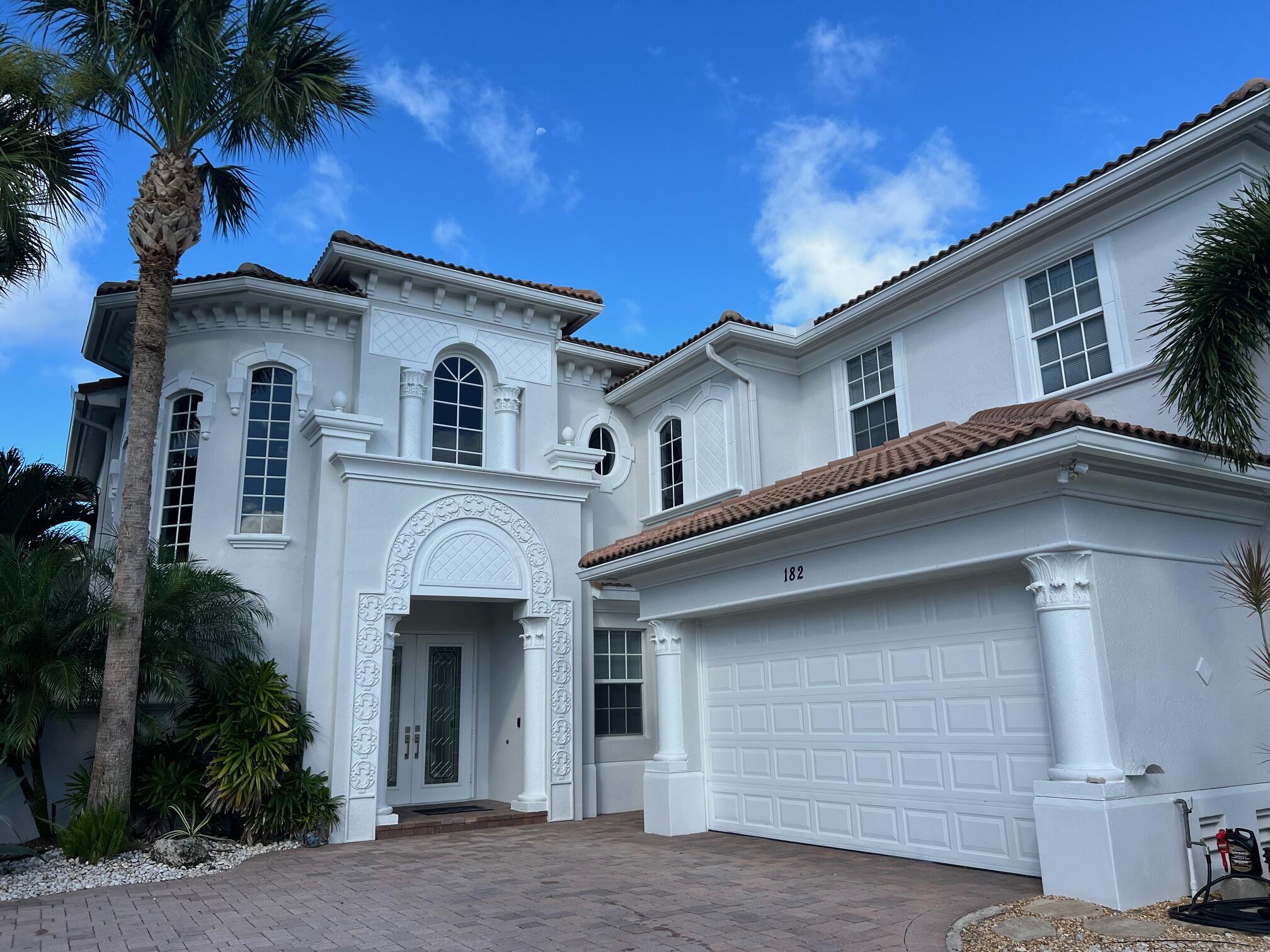 a front view of a house with a garage