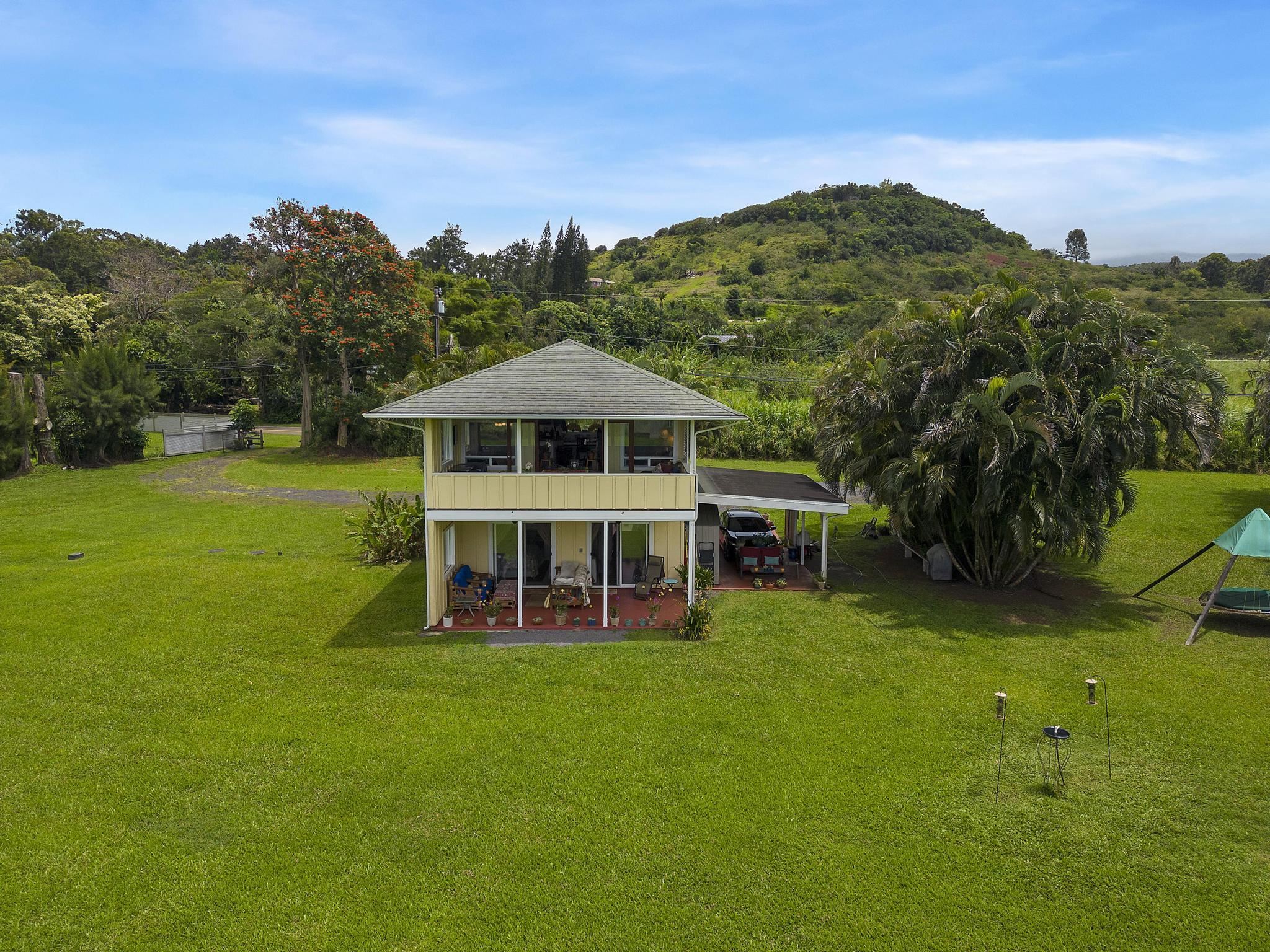 a view of a house with a big yard