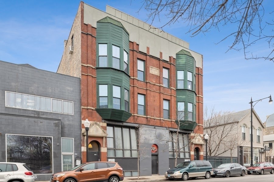 a view of a building with a street