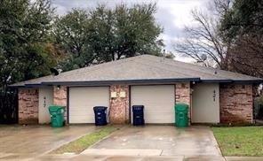 a front view of a house with garage