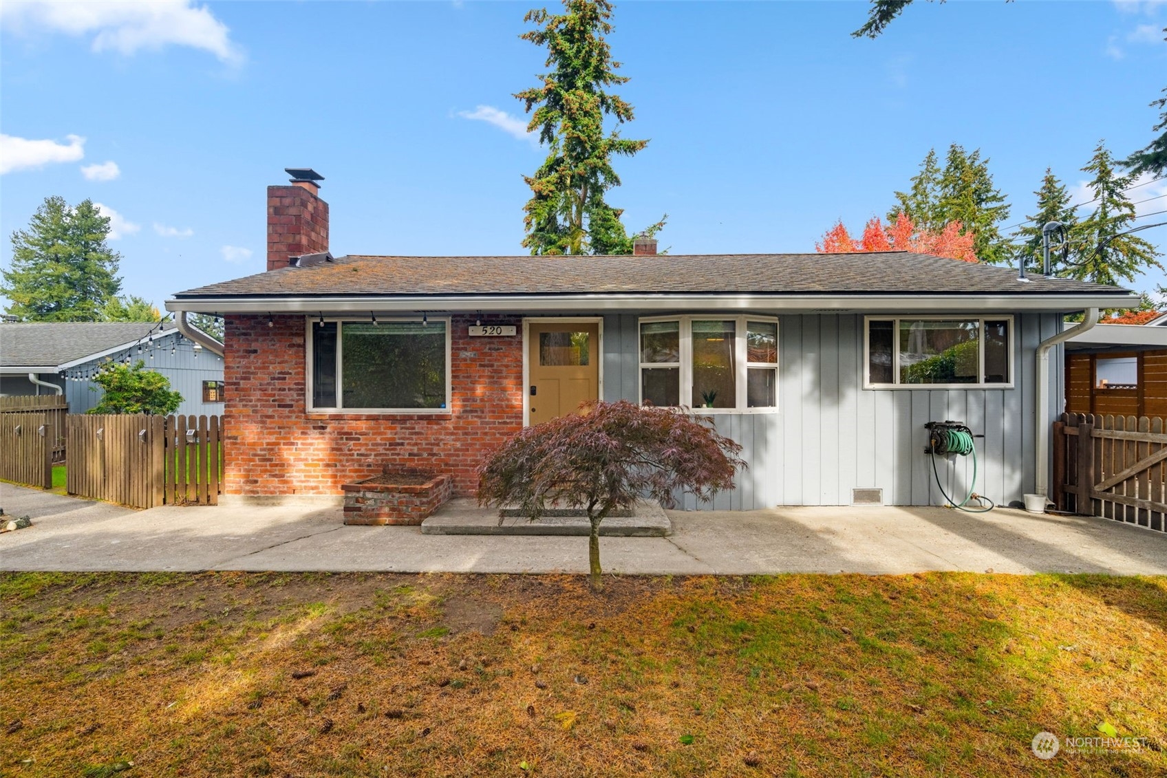 a view of a house with a yard