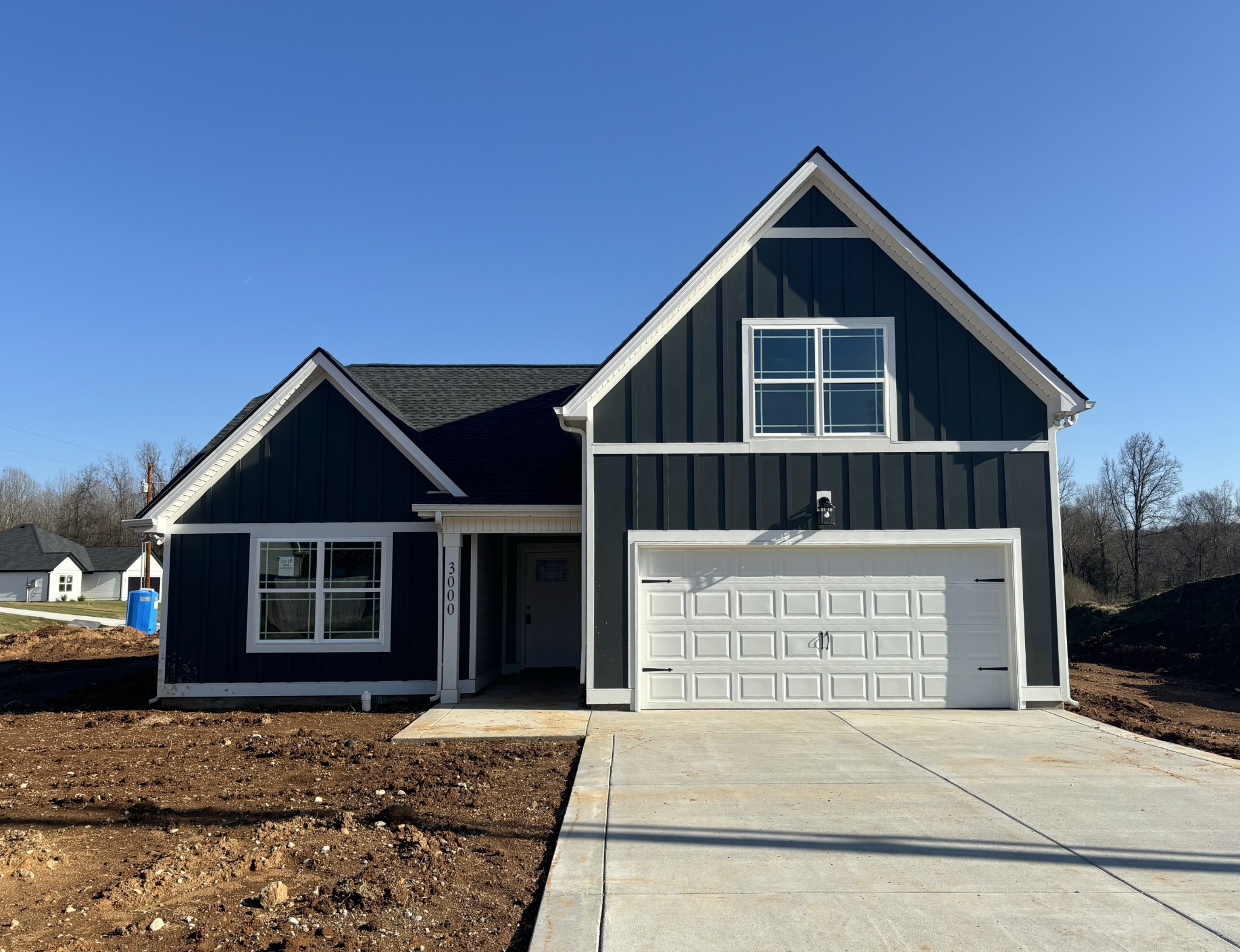 a front view of a house with a garage