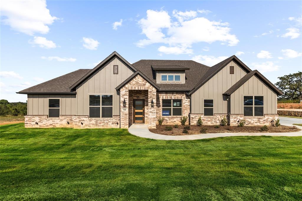 a front view of house with yard and patio