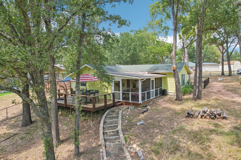 a view of a house with a yard and balcony