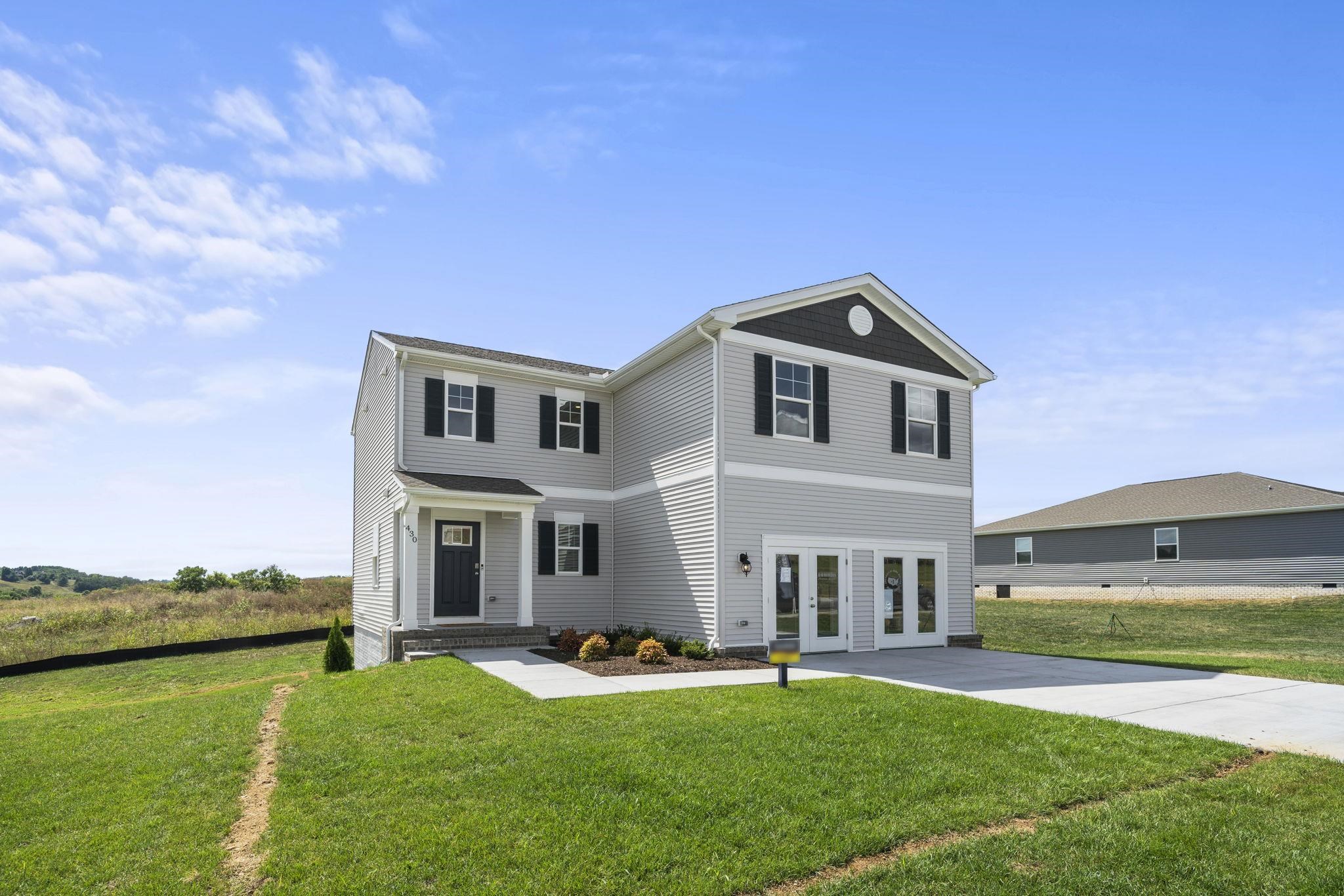 front view of a house with a yard