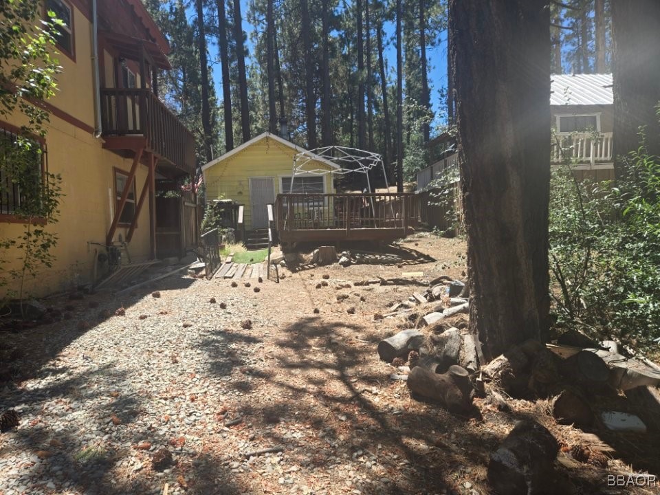 a view of a backyard of the house