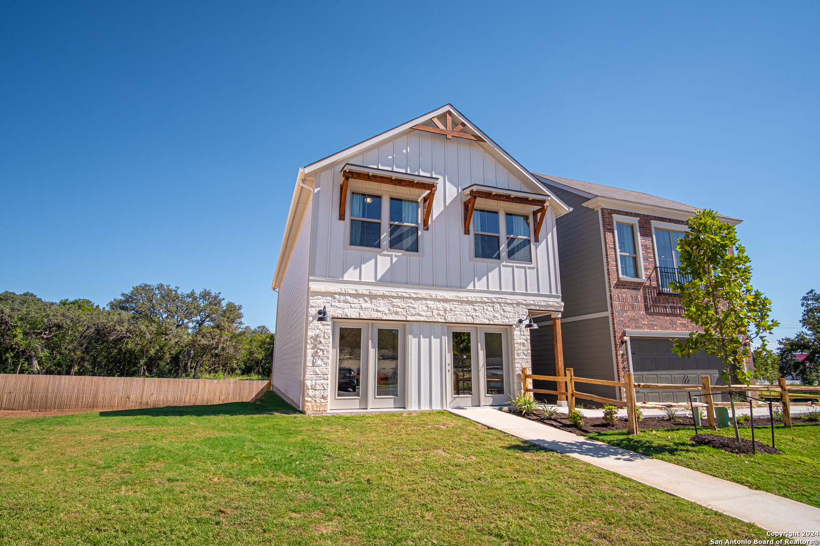 a front view of a house with a yard