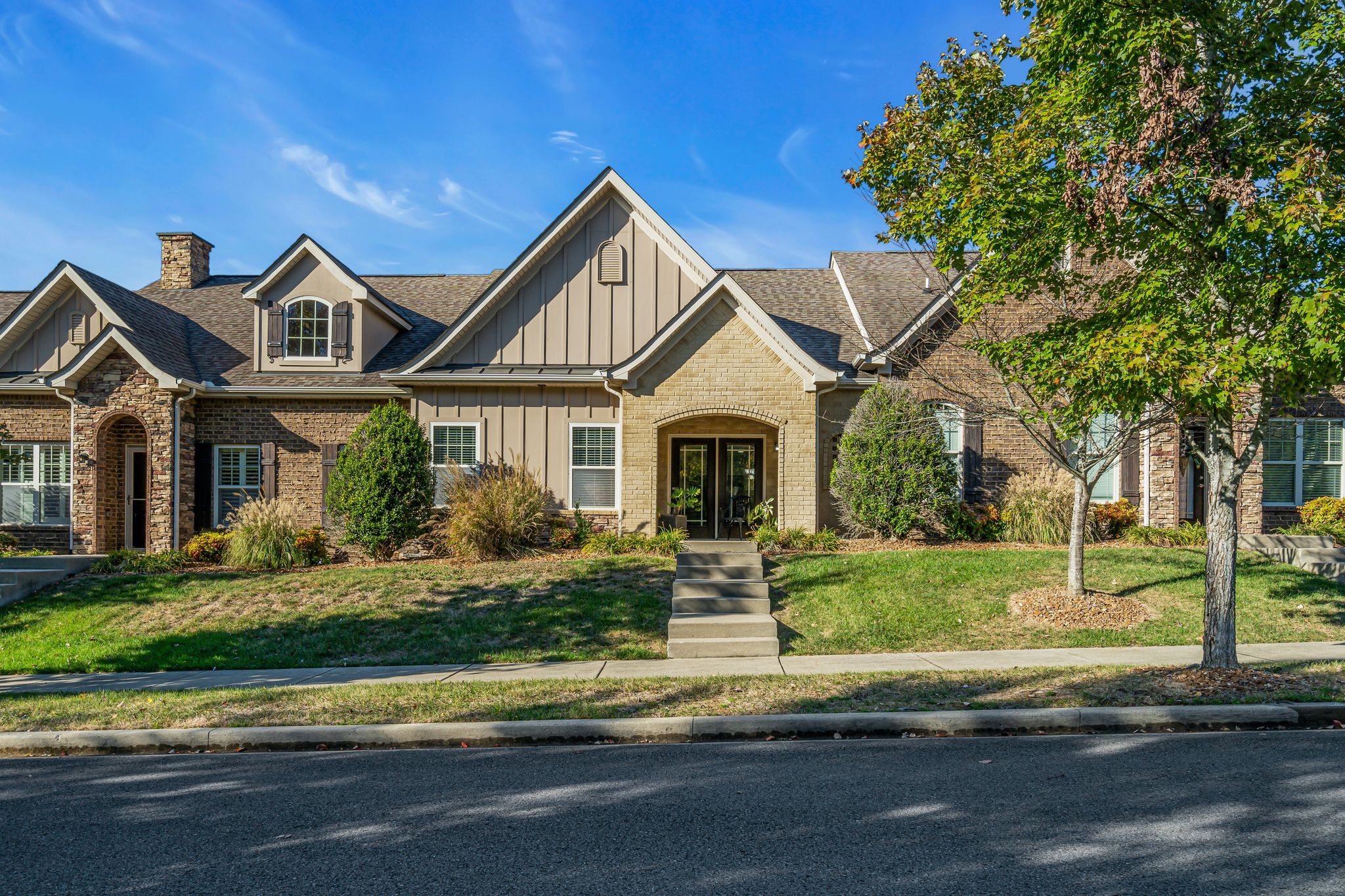 a front view of a house with a yard