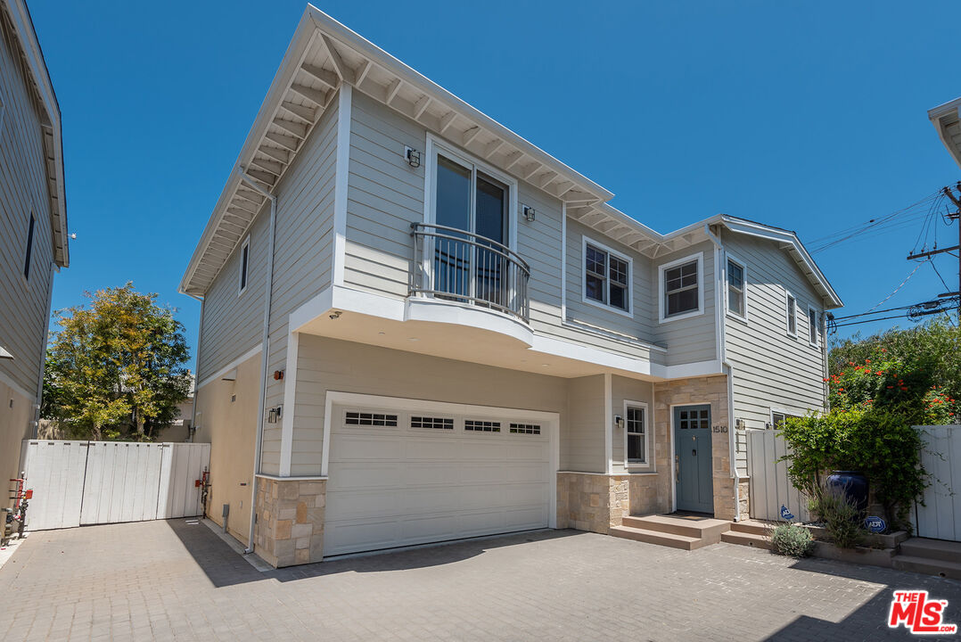 a front view of a house with a garage