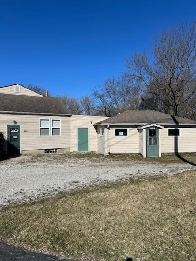 a view of a house with a yard