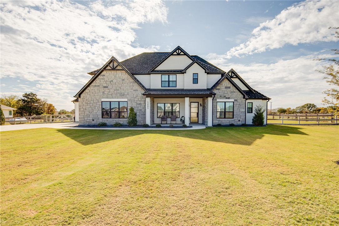 View of front of property with a front lawn