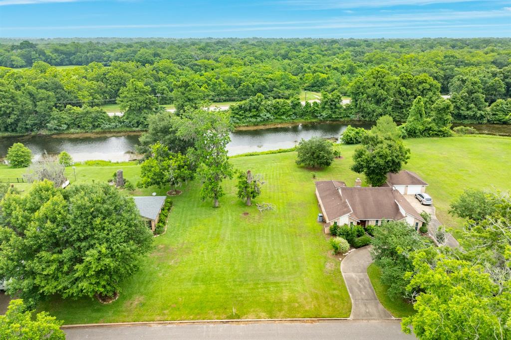 an aerial view of a houses with a yard