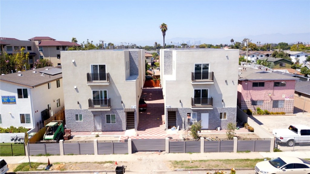 a view of multiple houses with a street