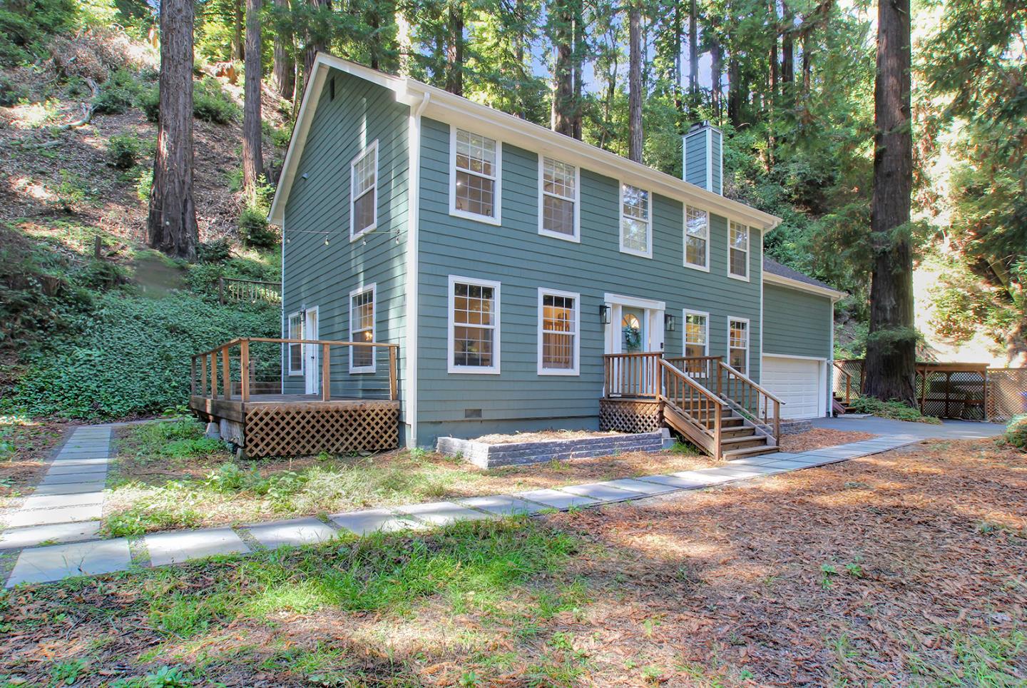 a view of a house with backyard porch and sitting area