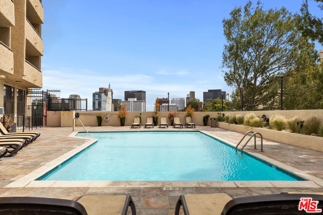 a view of a swimming pool with a patio