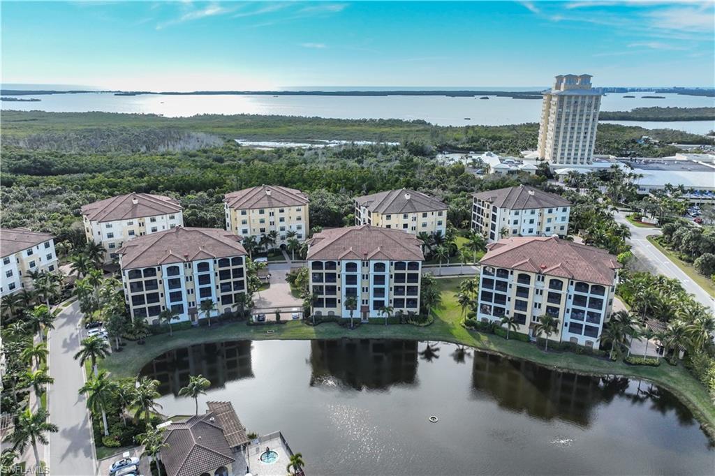 an aerial view of multiple houses with yard