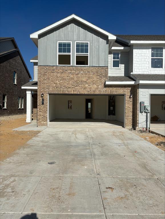 a front view of a house with a garage