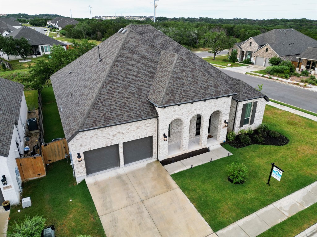 a aerial view of a house with a yard