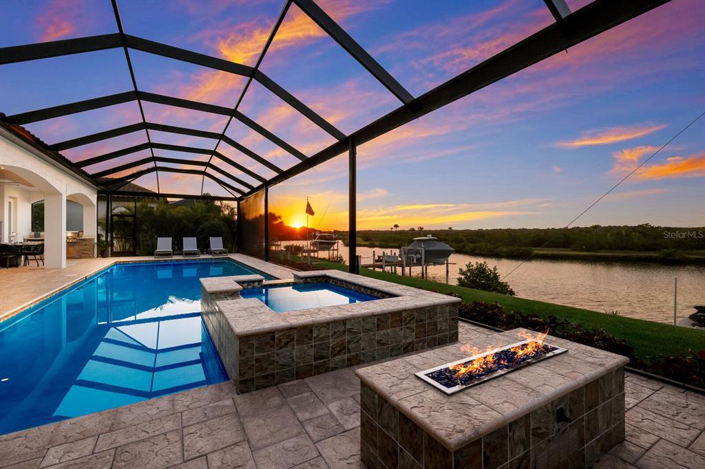 a outdoor space with patio lots of water view and sitting space