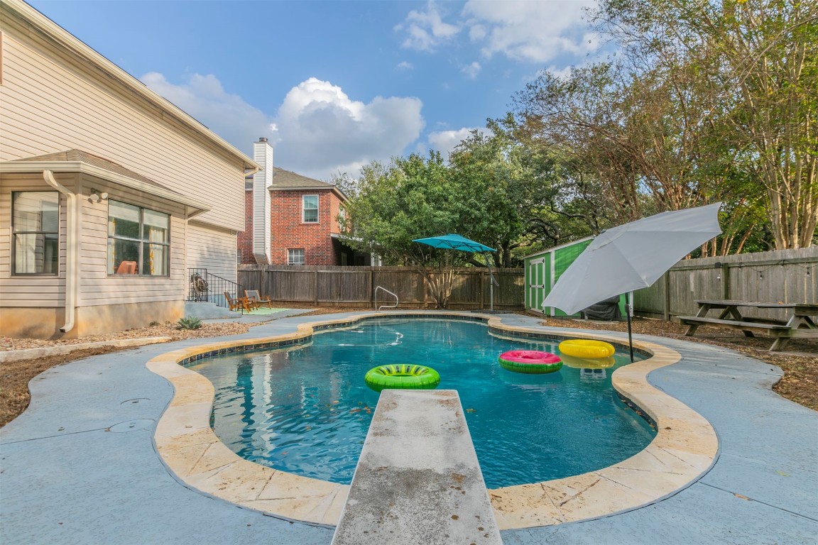 a view of a swimming pool with a lounge chairs