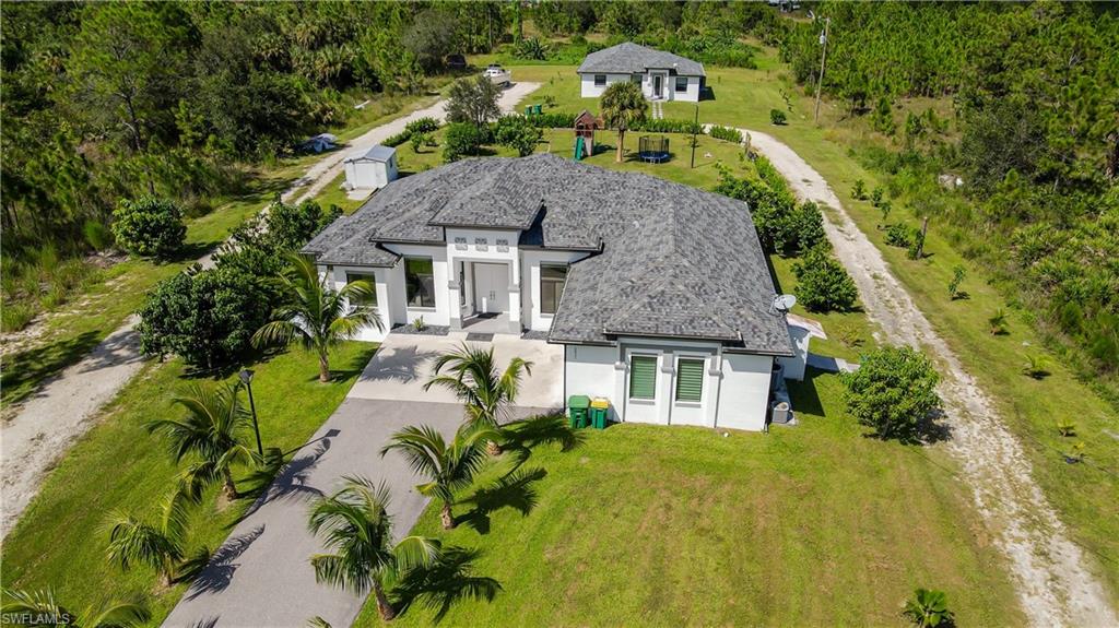 an aerial view of a house with a garden