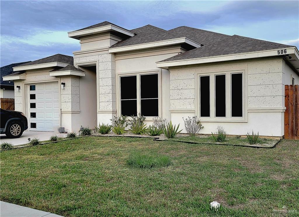 a house that is sitting in the grass