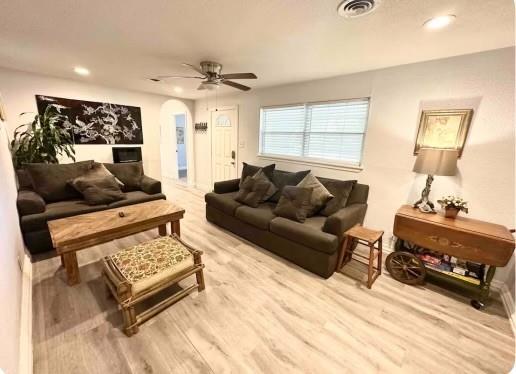 a living room with furniture and a window