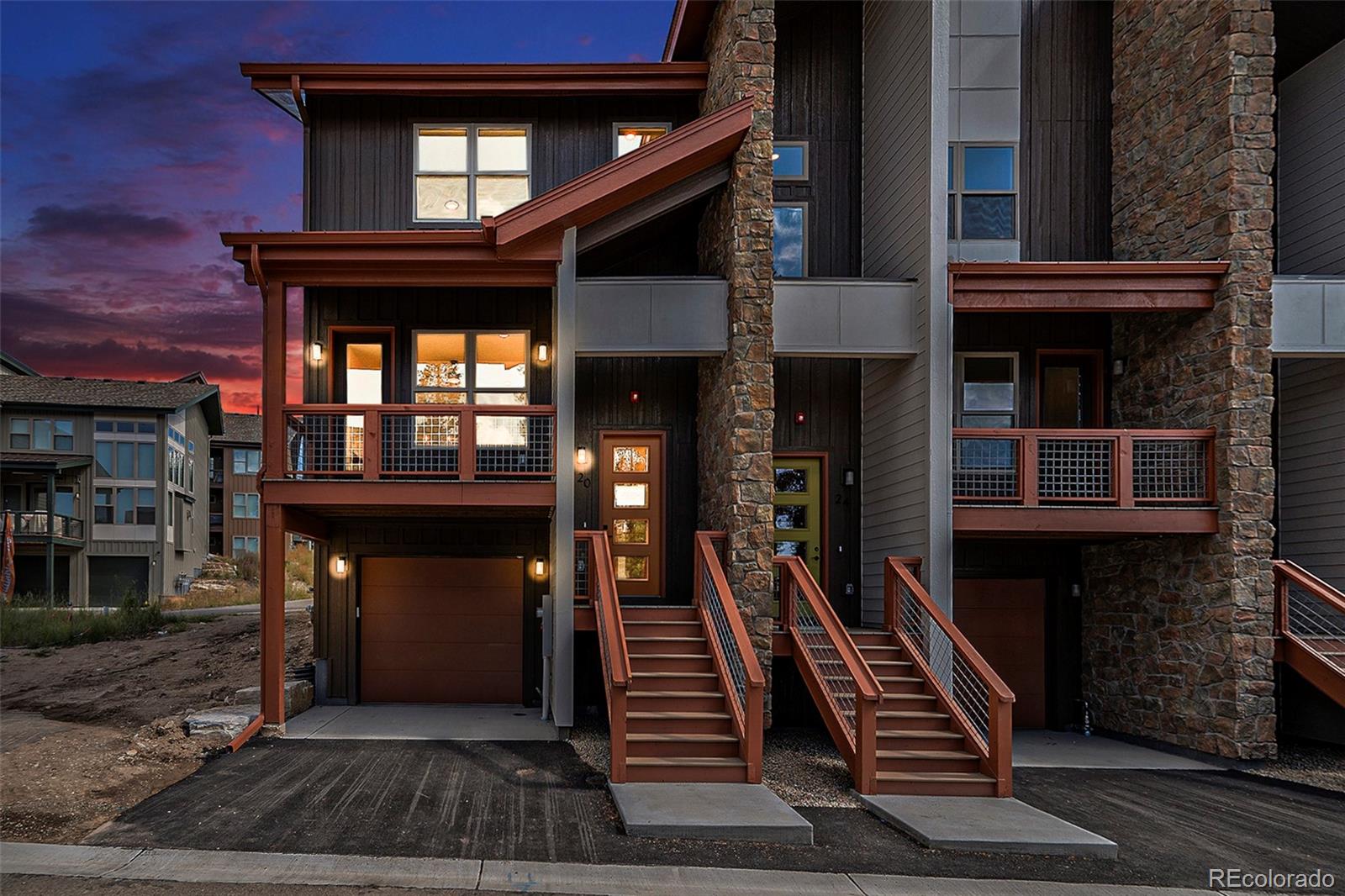 a front view of a house with stairs