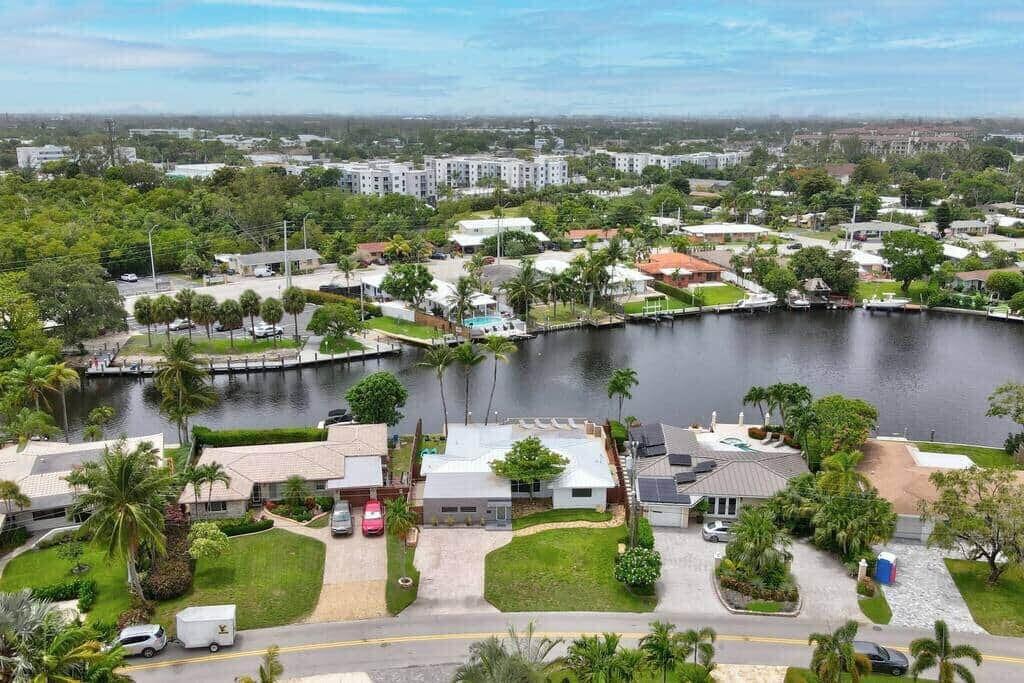 an aerial view of a house with a lake view