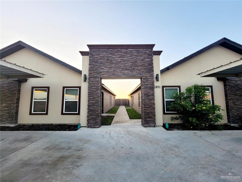 front view of a house with a yard