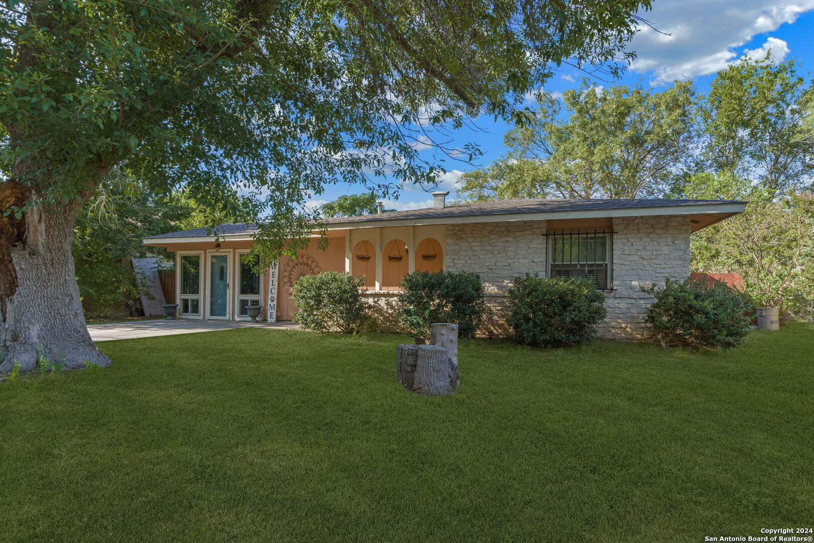 a front view of a house with garden